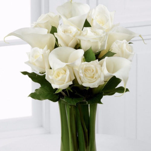 White Rose and White Calla Lily - Beautiful white roses and calla lilies are simply set amongst lush greens and hand tied to create a meaningful gift. Toronto Online Flower Delivery Service for Luxury Roses providing free delivery in the greater Toronto area for Birthdays, Anniversary, New baby, Weddings, Mother’s Day and Valentines day