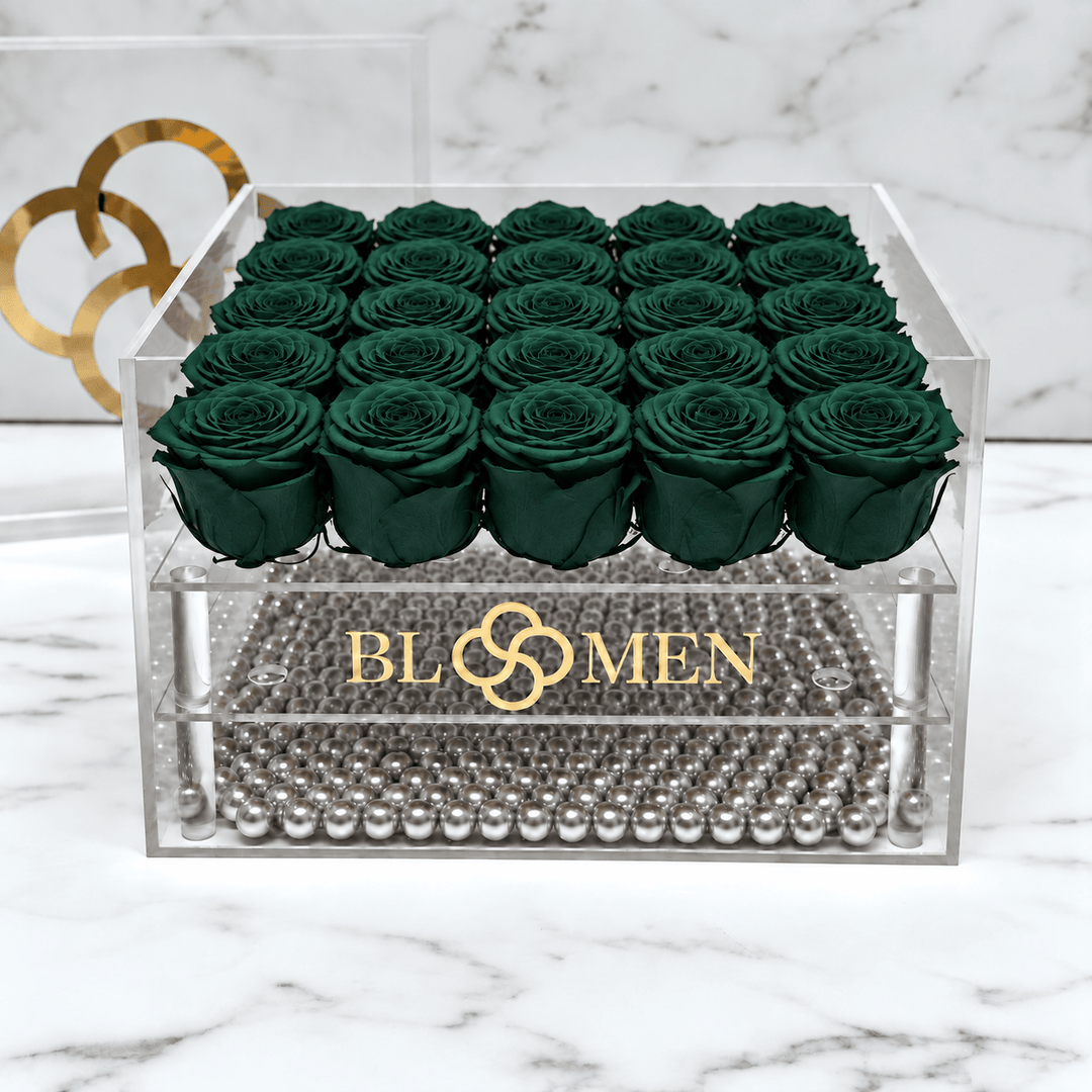 Top view of twenty-five hunter green everlasting roses in a five-by-five arrangement