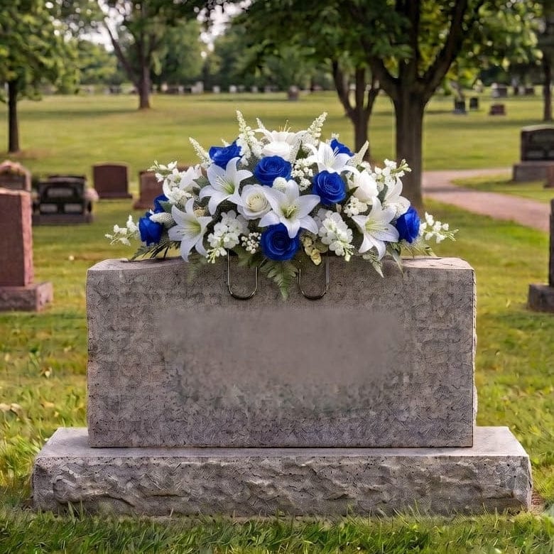 Tombstone Saddle: Lilies & Roses (Blue & White) - artificial memorial flowers on a headstone