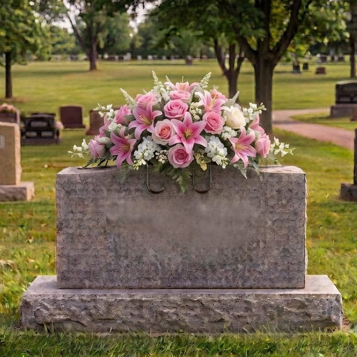 Tombstone Saddle: Lilies & Roses (Pink) - artificial memorial flowers on a headstone