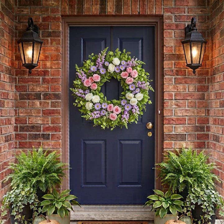 Spring door wreath with pink and white roses, lavender snapdragons and asters hanging on a front door