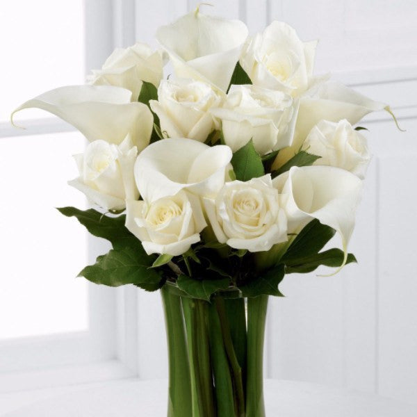 White Rose and White Calla Lily - Beautiful white roses and calla lilies are simply set amongst lush greens and hand tied to create a meaningful gift. Toronto Online Flower Delivery Service for Luxury Roses providing free delivery in the greater Toronto area for Birthdays, Anniversary, New baby, Weddings, Mother’s Day and Valentines day